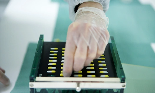 Hand with pill tray